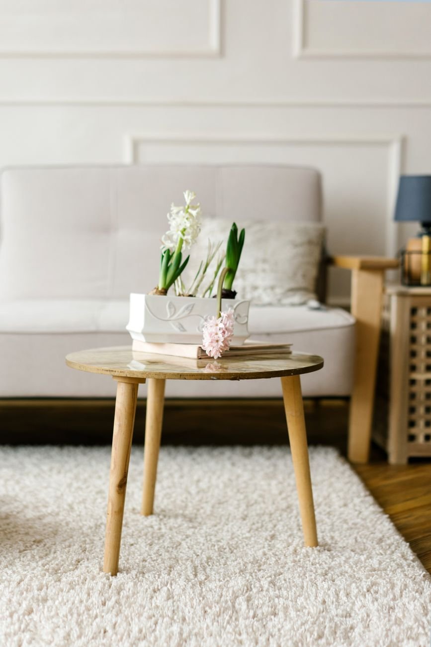 white flowers on brown wooden table